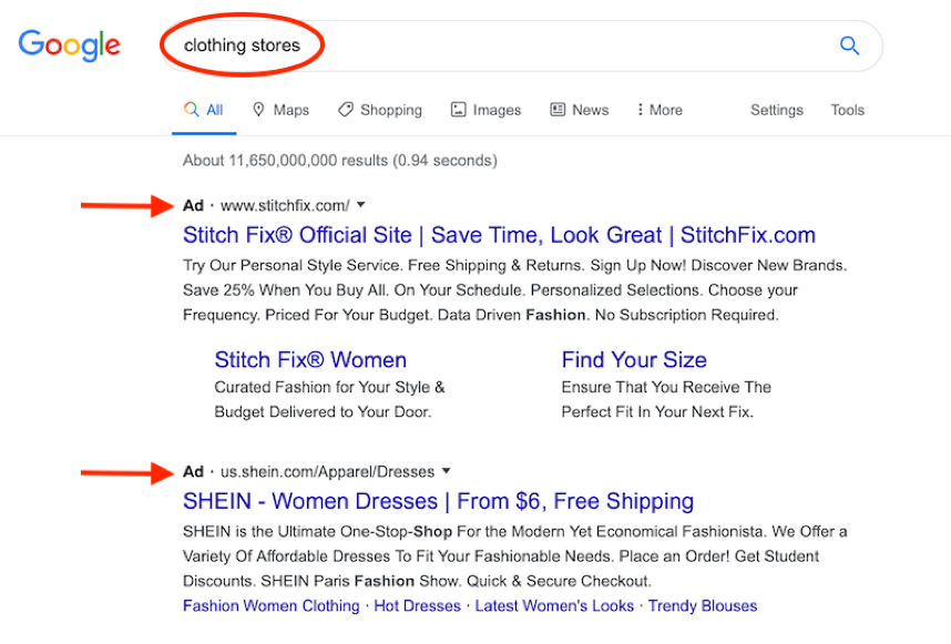 Google search of the word "clothing stores"  that has 2 arrows on 2 ad pages